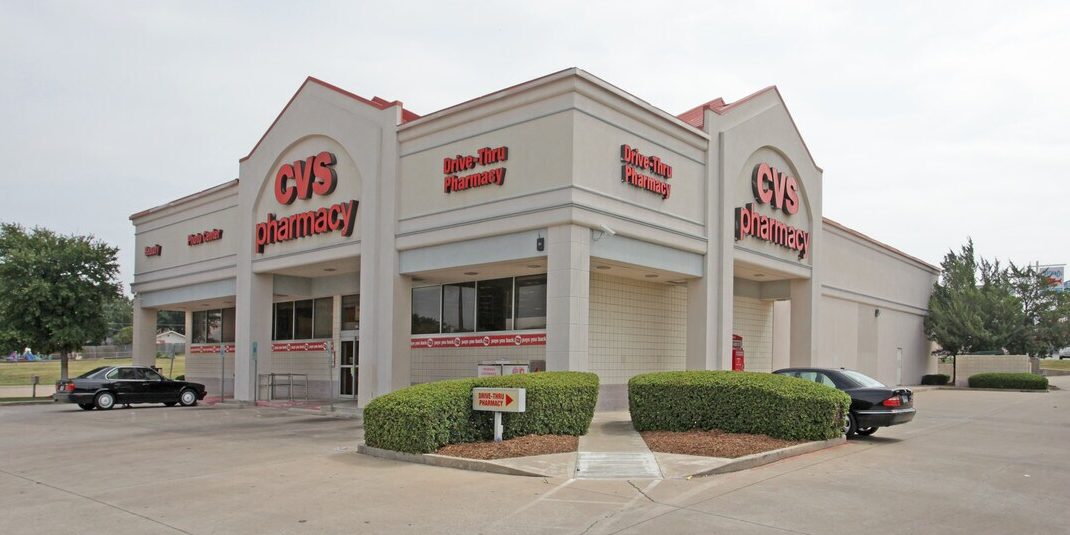 Exterior of 11,000 SF former CVS at 8520 Camp Bowie W Blvd, Fort Worth, TX with drive-thru lane, ~75 parking spaces, and strong road frontage.